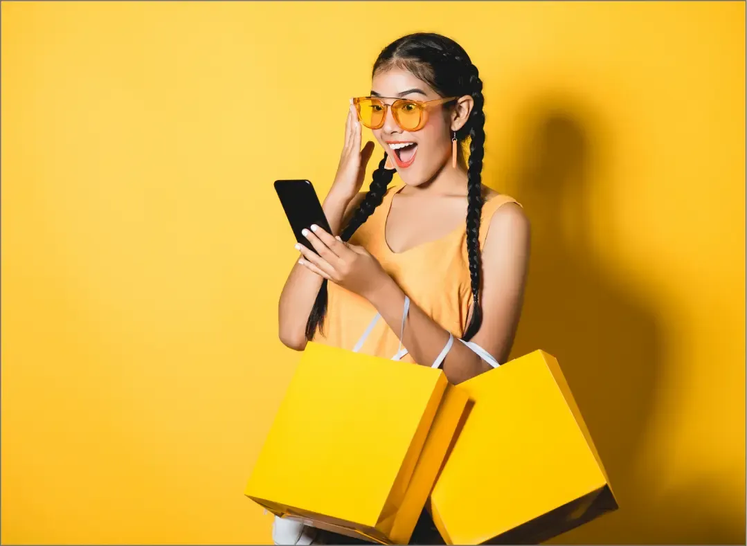 Enthusiastic shopper using a smartphone