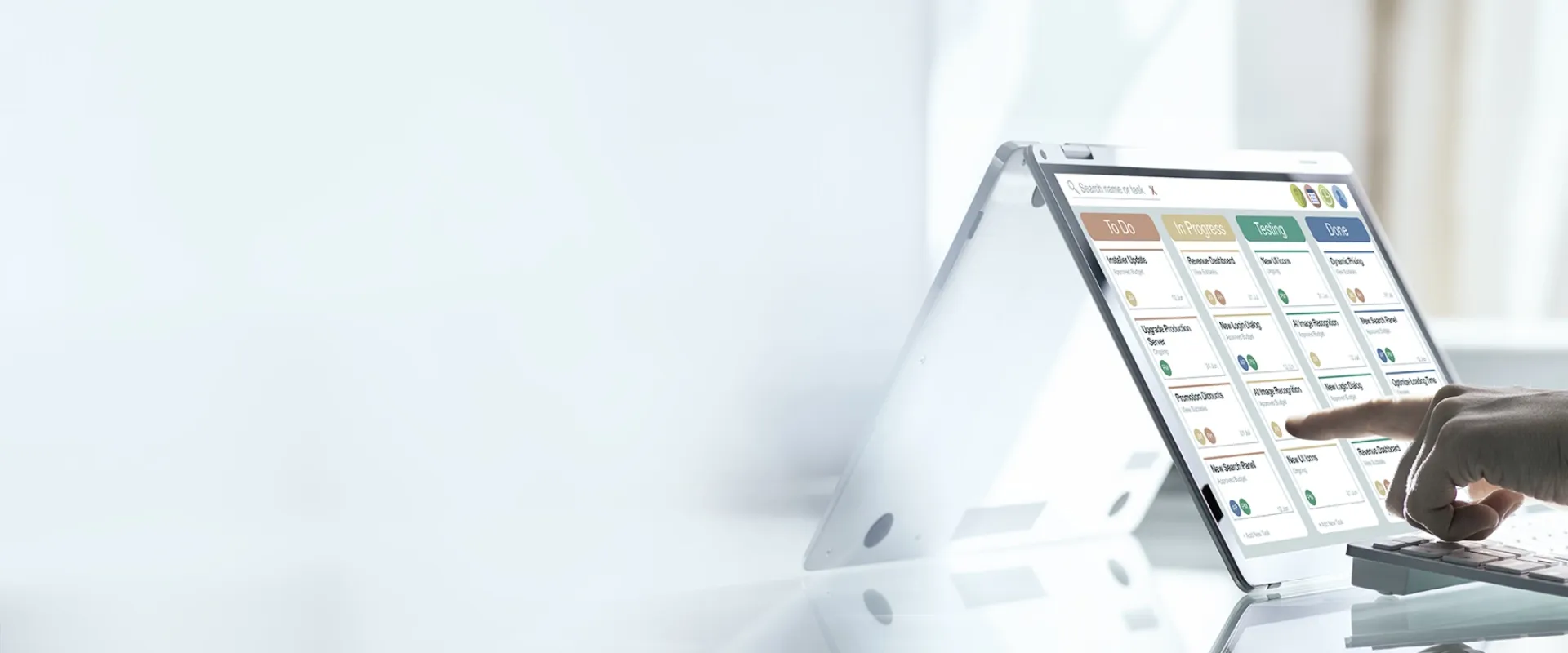 Close-up of a person interacting with a digital task management dashboard on a tablet
