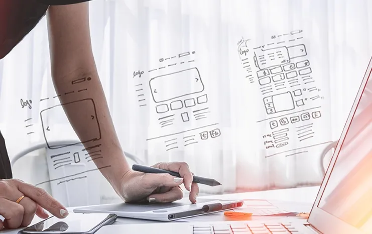 Trinergy's UX/UI design process showcasing wireframe sketches and digital tools