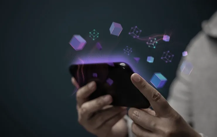 Person using a smartphone with digital cubes and network elements symbolizing digital