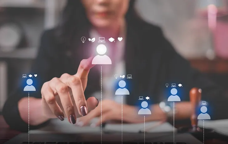 A businesswoman interacting with a digital interface, selecting a customer icon