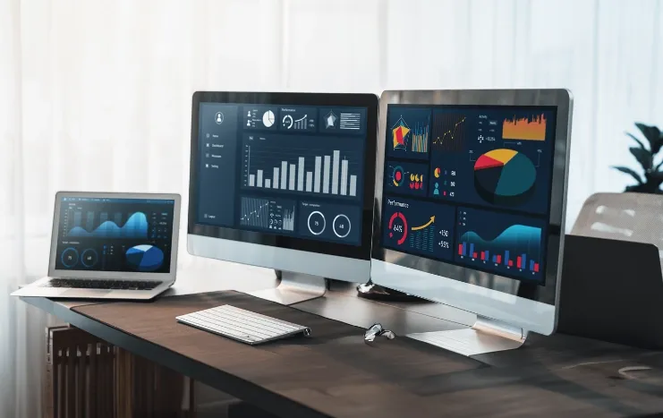 Trinergy's advanced data analytics dashboards displayed on multiple monitors for comprehensive data