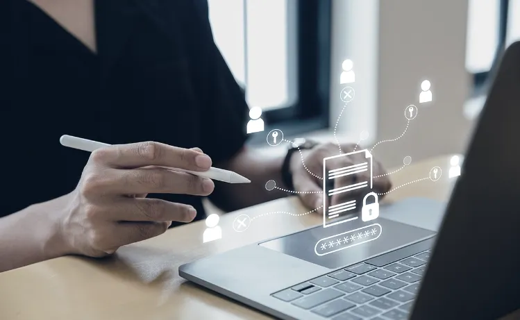 A professional using a laptop with a stylus