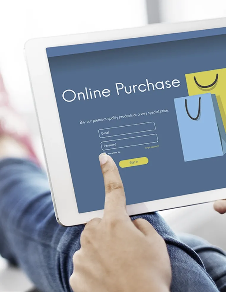 A person using a tablet with an online purchase interface