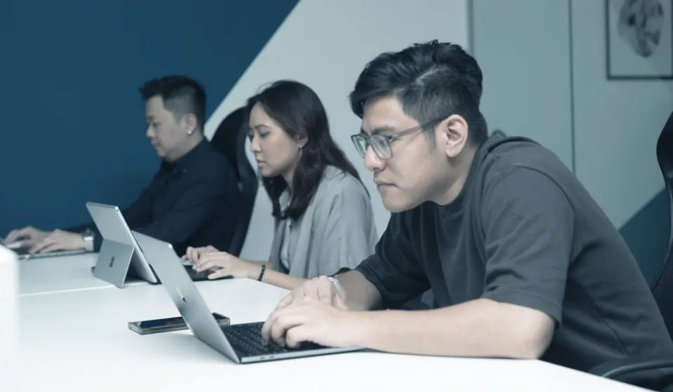 Trinergy team member working at a desk