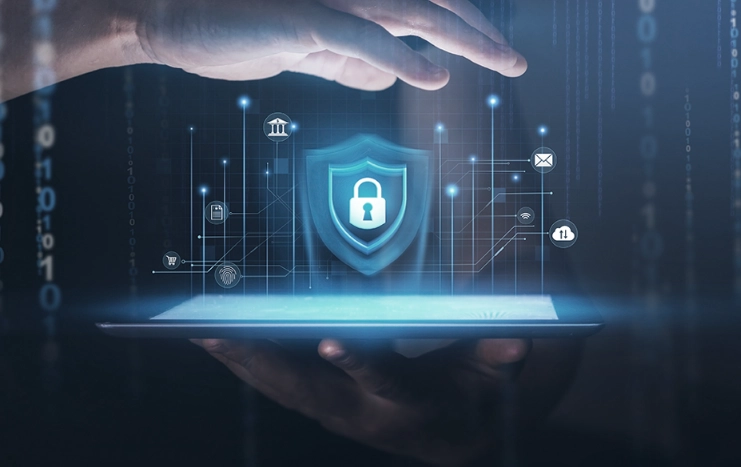 Digital shield icon hovering over a tablet, representing Trinergy's advanced cybersecurity solutions to protect digital assets.